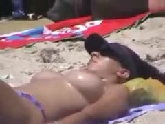 Nice voyeur movie scene of bewitching bazookas and boobies tanning on the beach 